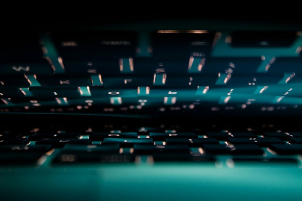 Laptop with cyan light illustrating reseller panel account security and two-factor authentication