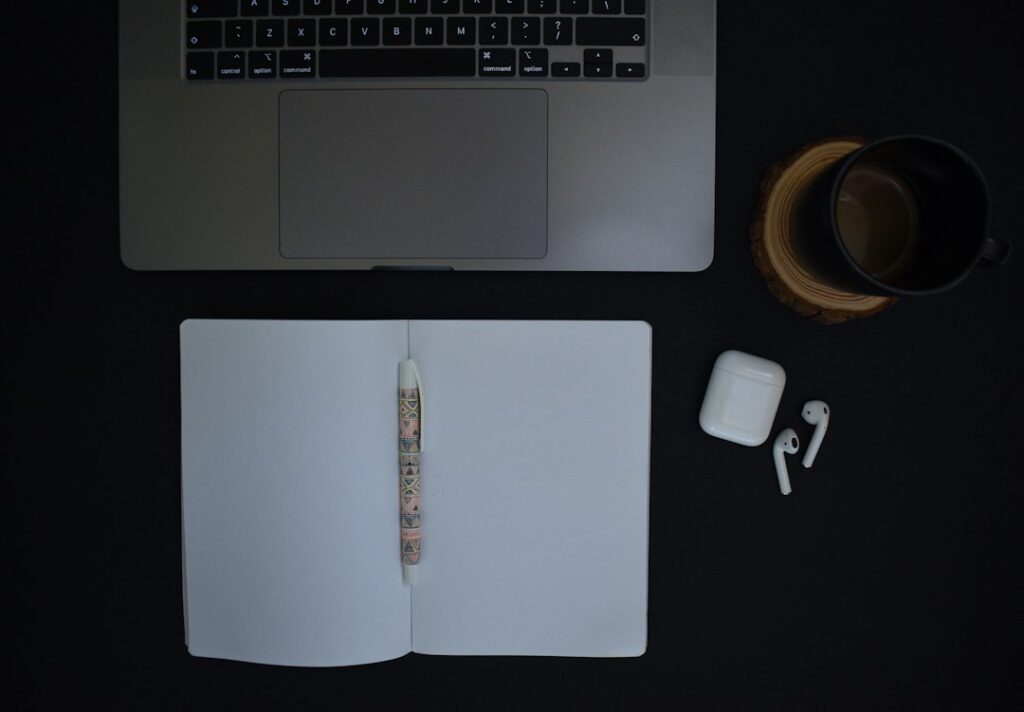 Laptop and notebook on a dark desk illustrating a reseller account correction checklist